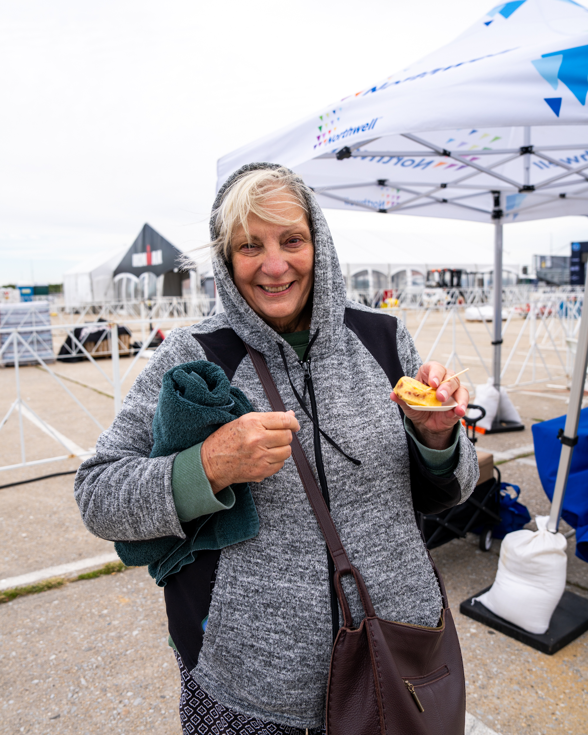 Event staff plating gourmet samples for triathlon participants at Jones Beach