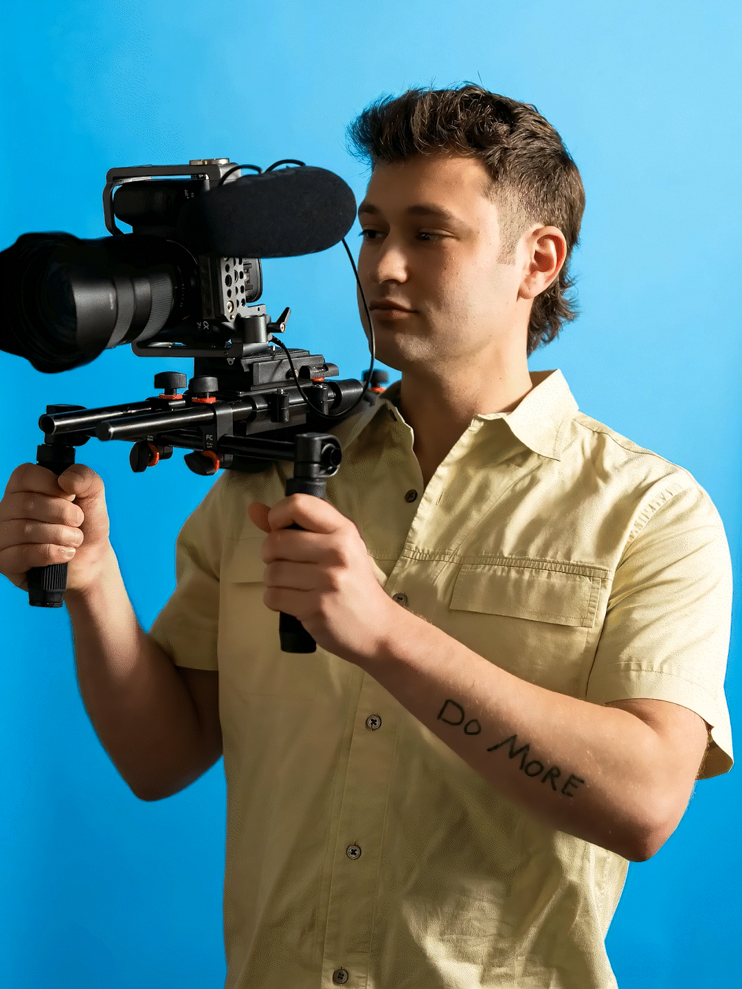 James Ryan collaborating with a client on set with camera gear