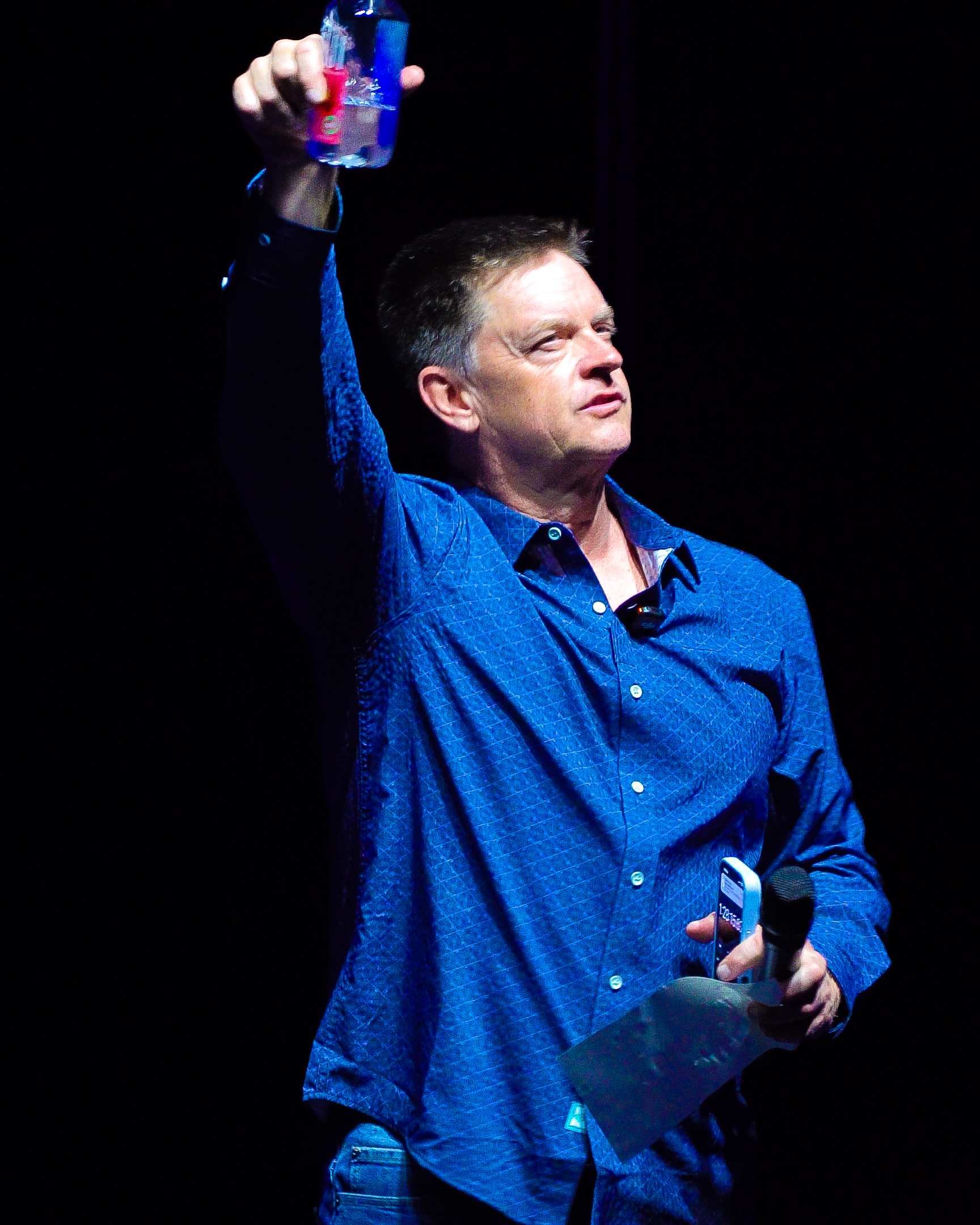 Jim Breuer performing live on stage during a comedy show