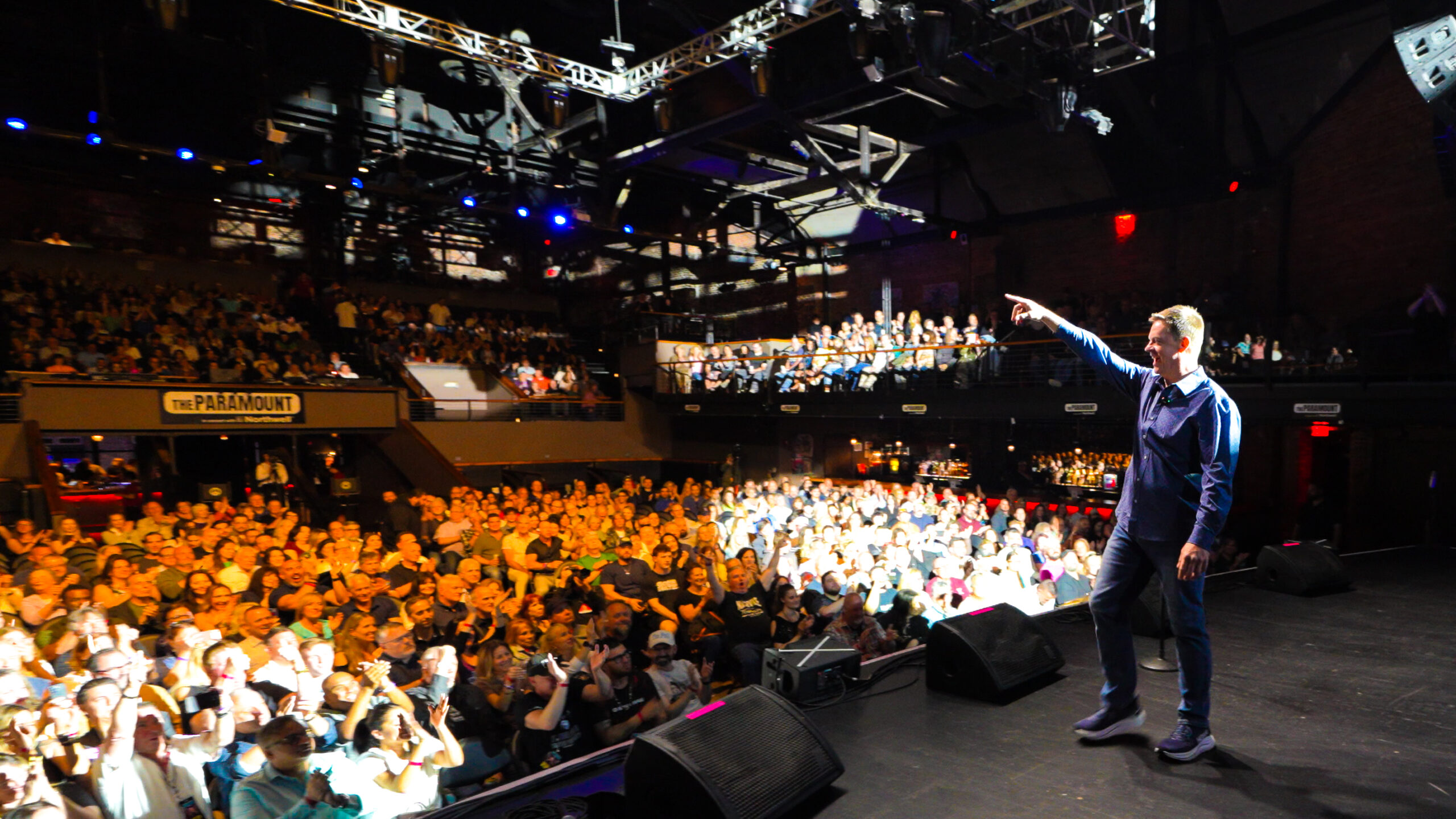 Live stage performance captured with cinematic concert lighting