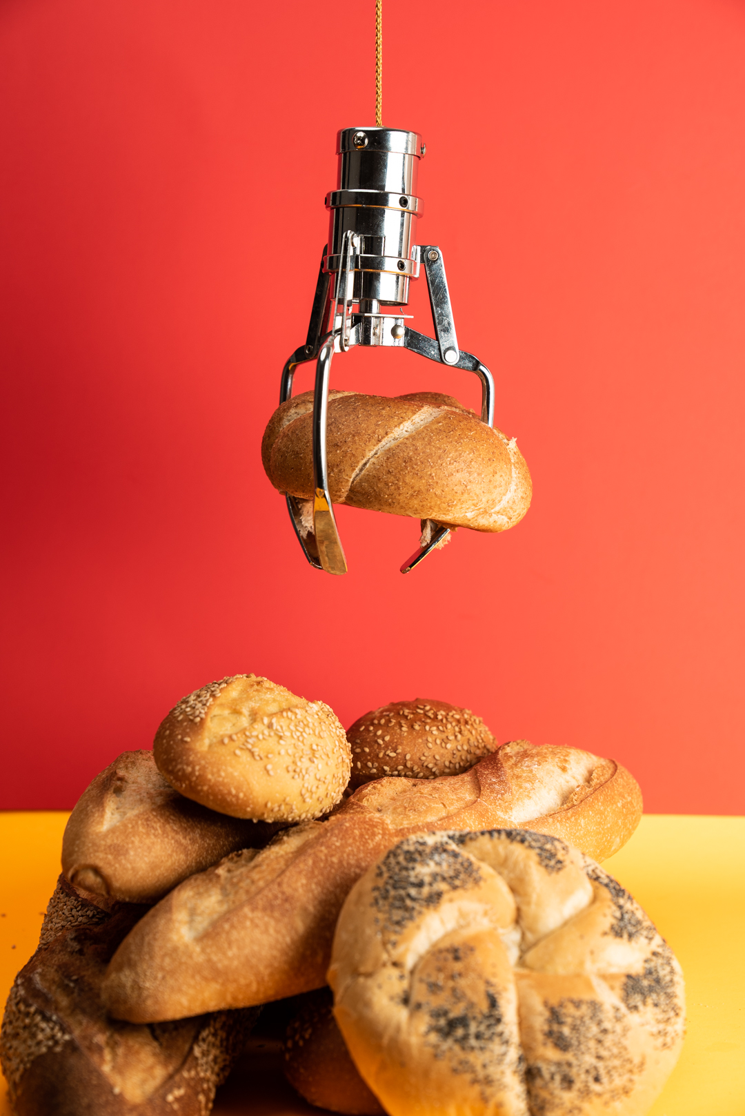 Monreale Bread Co baker dusting flour over shaped artisan sourdough loaves